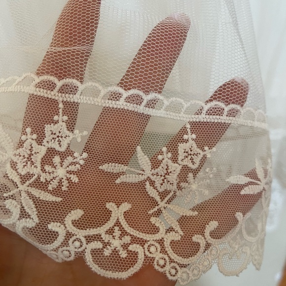 Tiers of tulle are layered atop a perfectly-cut T-shirt with added lace accents. - Picture 5 of 10